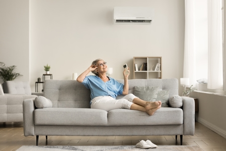 person enjoying ductless AC comfort